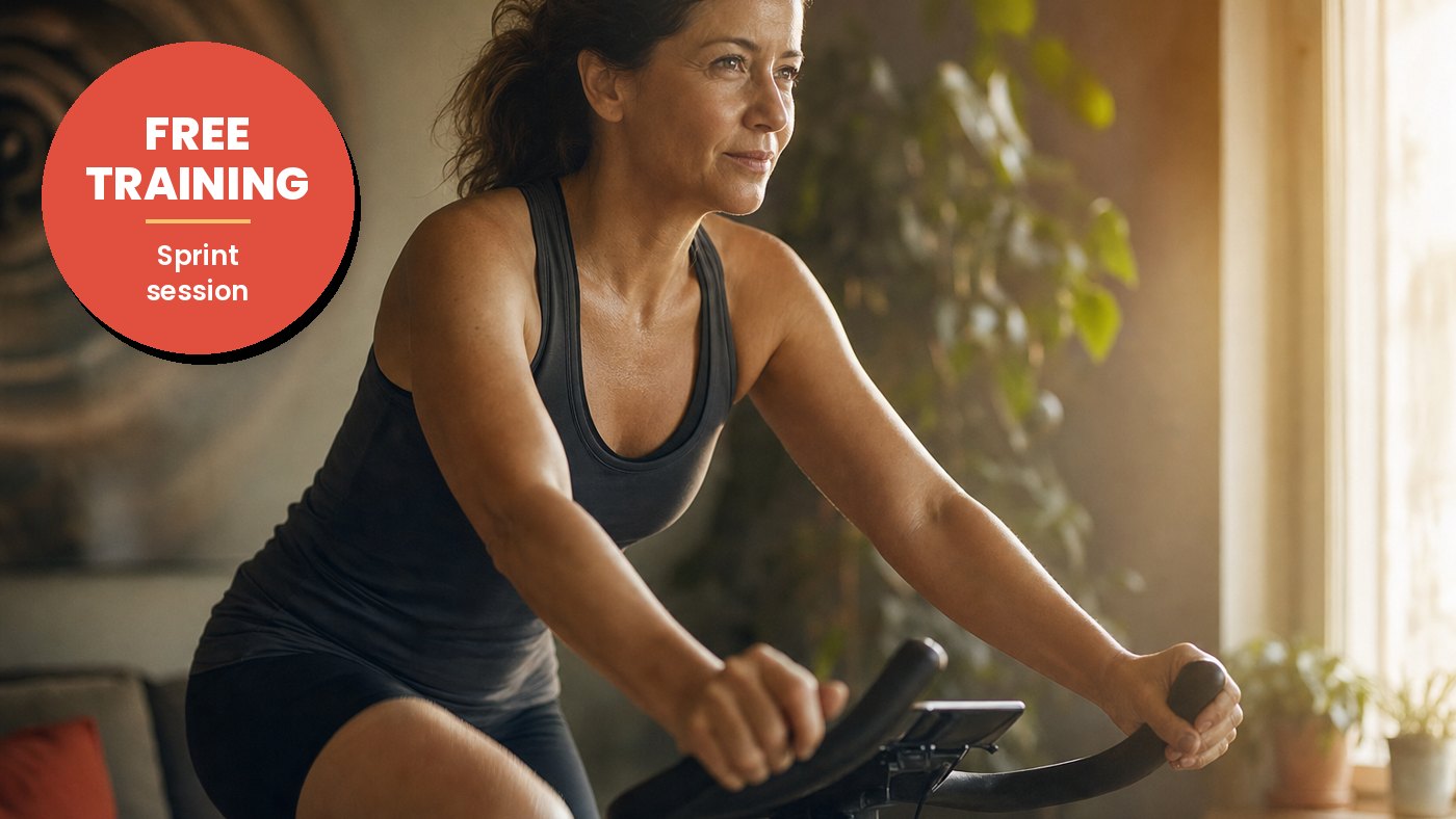 Woman sprinting on an exercise bike in a bright living room